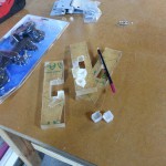 Nathan is making a transparent acrylic puzzle